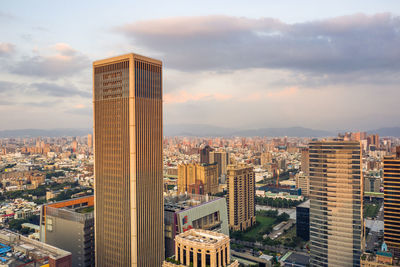 High angle view of buildings in city against sky