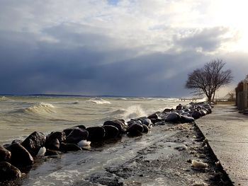 Scenic view of sea against sky during winter