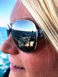 Close-up portrait of man wearing sunglasses