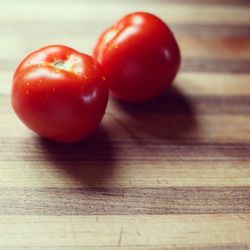 Close-up of tomatoes on wooden table