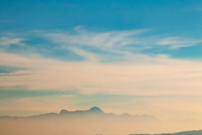 Low angle view of silhouette mountain against sky during sunset