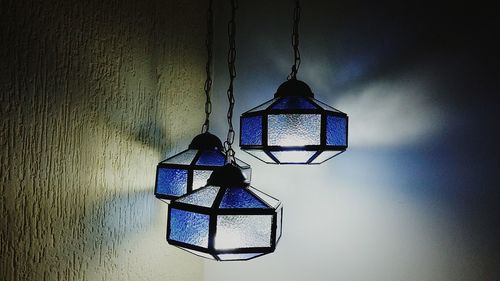 Close-up of illuminated light bulb hanging