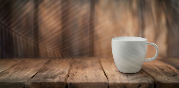 Close-up of coffee cup on table