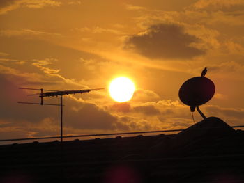 Low angle view of silhouette land against sky during sunset