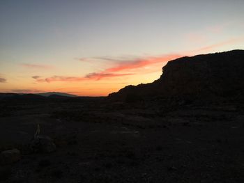 Scenic view of landscape against sky during sunset