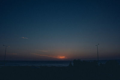 Scenic view of sea against clear sky during sunset