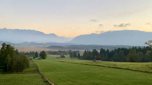 Scenic view of landscape against sky during sunset