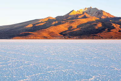 Scenic view of mountains against sky during winter