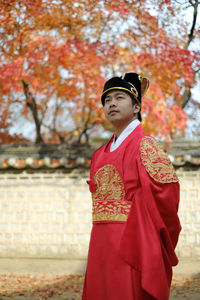 Young man posing as the country's emperor.