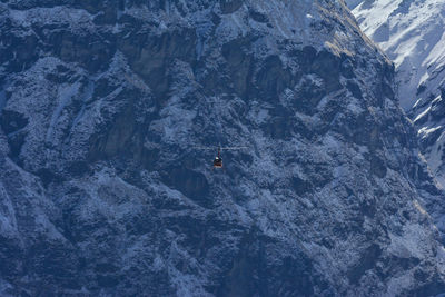 High angle view of helicopter against snowcapped mountain, anapurna