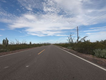 Empty road against sky