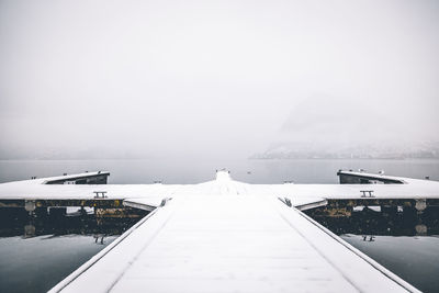 Scenic view of sea against clear sky during winter