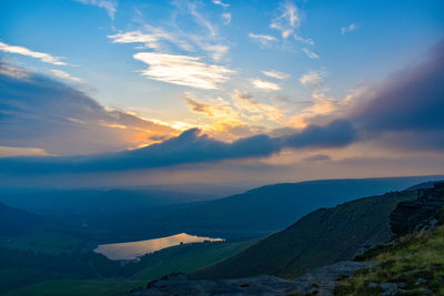 Scenic view of mountains against sky during sunset