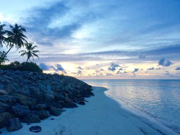 Scenic view of sea against sky at sunset