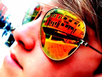 Close-up of woman holding sunglasses