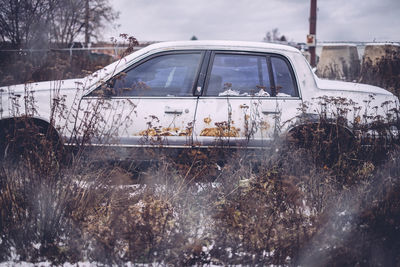 Cars in parking lot against sky