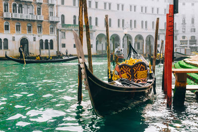 Boats moored in canal