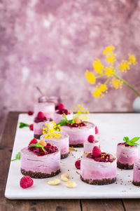 Close-up of cake with flowers on table