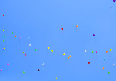 Low angle view of balloons in sky