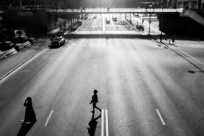 High angle view of people crossing road