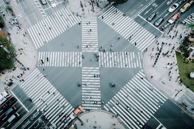 High angle view of people crossing road in city