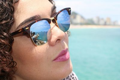 Close-up portrait of woman wearing sunglasses