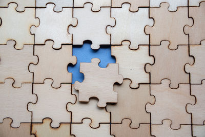 Full frame shot of wooden jigsaw puzzle