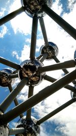 Low angle view of metal structure against sky