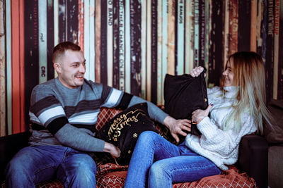 Man sitting on sofa at home