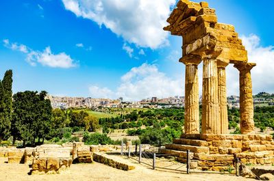Old temple against cloudy sky