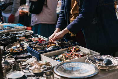 Looking for antique utensils at the flea market