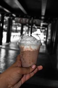 Close-up of hand holding ice cream