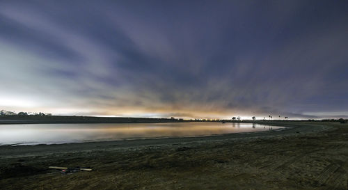 Scenic view of lake against sky during sunset