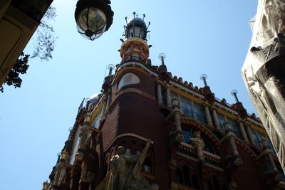 Low angle view of built structure against clear blue sky