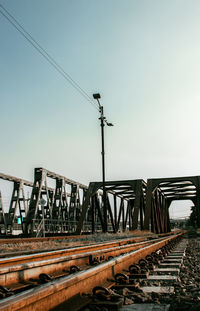 Railroad tracks against clear sky