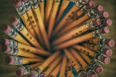 Directly above shot of pencils in container on table