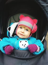 Portrait of cute baby girl with toy