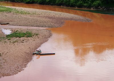 Aerial view of fishing boat on river