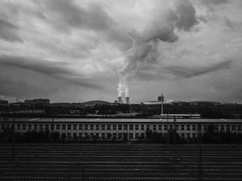 View of factory against cloudy sky