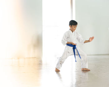 Boy standing on floor at home