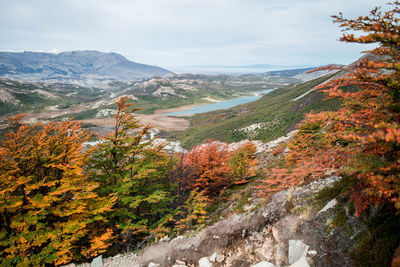 Scenic view of mountains and lake against sky during autumn