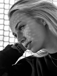 Close-up portrait of young woman looking away