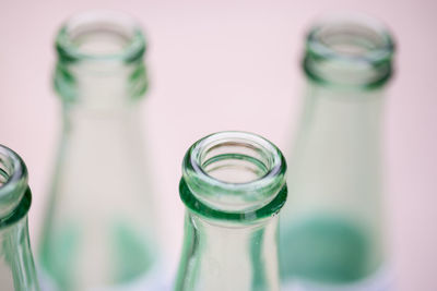 Detail shot of glass bottles against white background