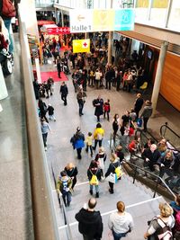 High angle view of people standing in city