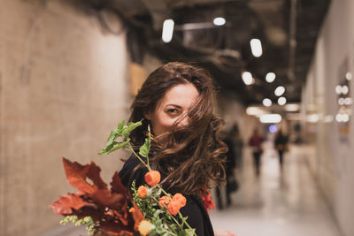 Portrait of woman holding bouquet 