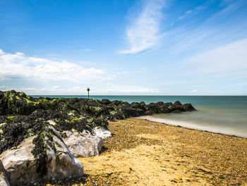 Scenic view of beach against sky