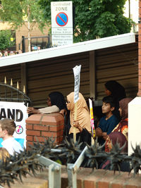 Rear view of woman against building