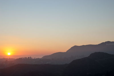 Scenic view of mountains against sky during sunset