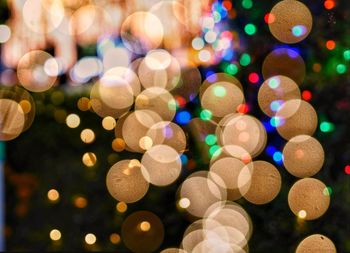 Close-up of illuminated defocused christmas lights at night