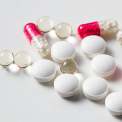 Close-up of pills on white background